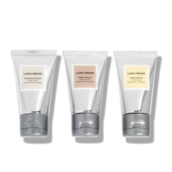 Three tubes of Laura Mercier product on a white background