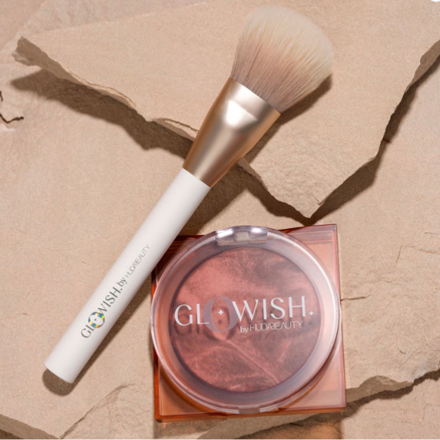 huda beauty glowish all over bronzer brush with blusher on rock